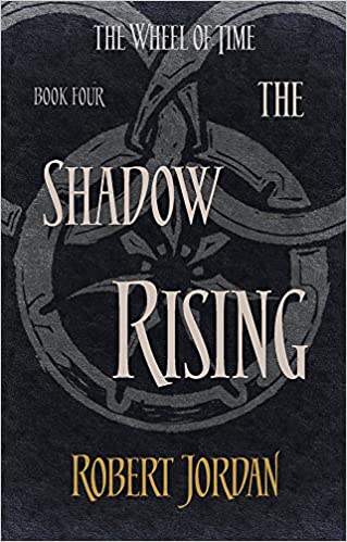 Image of a snake eating its tail with the words The Shadow Rising by Robert Jordan